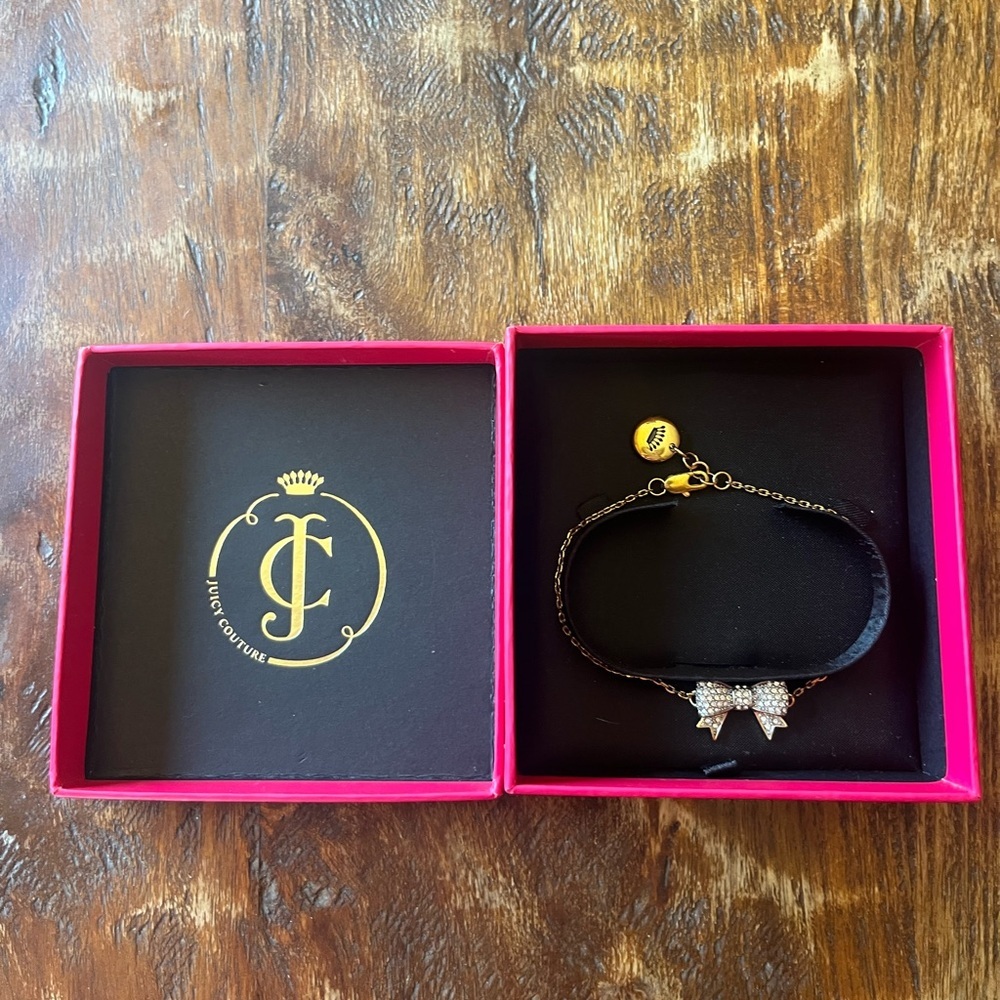 Juicy Couture gold plated rhinestone bow bracelet